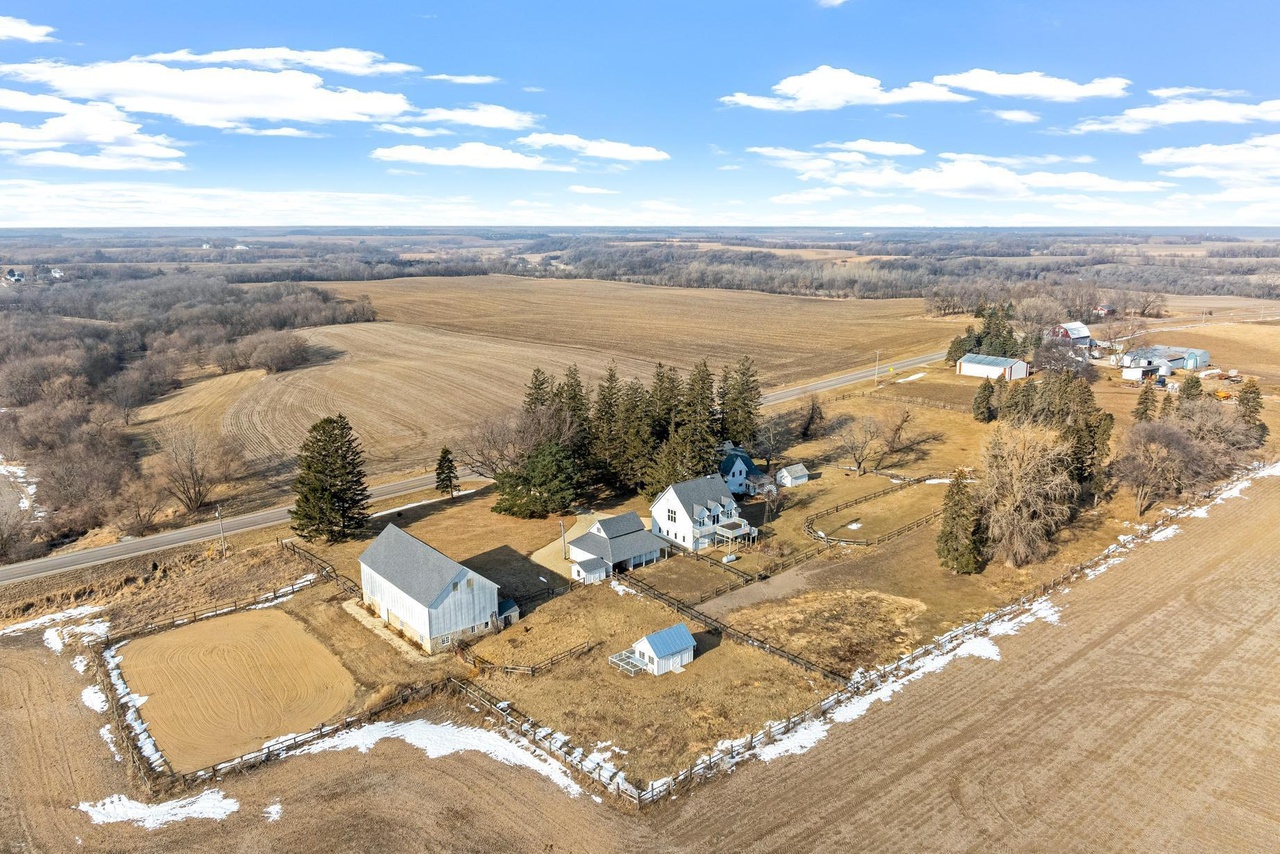 Aerial view of the entire Becht Acres property showing farmhouse, barn, and surrounding fields in southern Minnesota